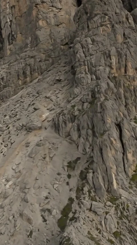 Vertical screen towering limestone cliff face Dolomites. Aerial drone reveals Vidéo 323242557
