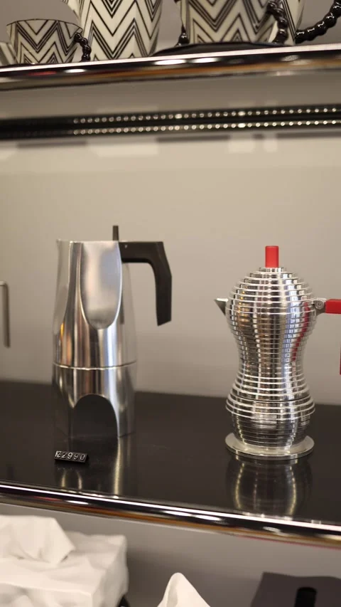 Vertical screen two modern metal coffee makers with black and red handles displa Stock Footage 318869392