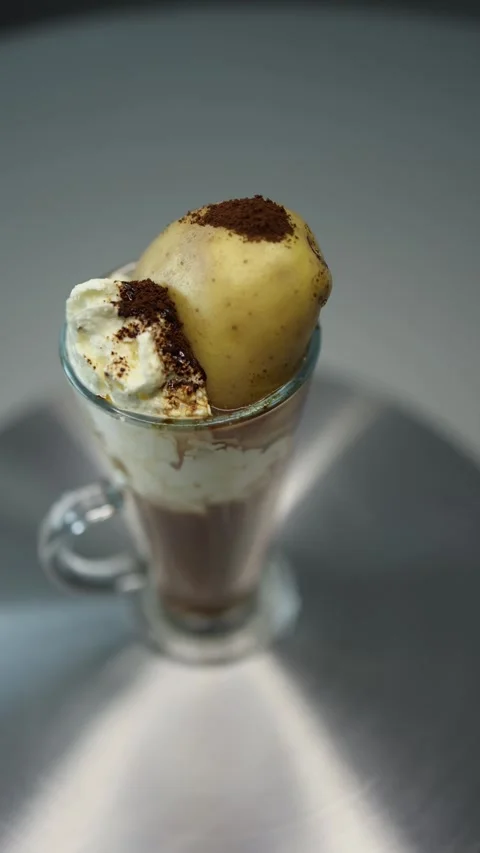 Vertical screen: A unique cappuccino topped with real potato, symbolizing Belaru Video stock 300021470