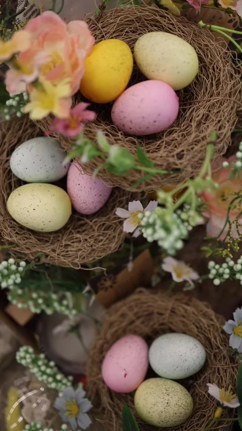 Vertical screen unsold decorative Easter eggs arranged in small straw Stock Footage 330014767
