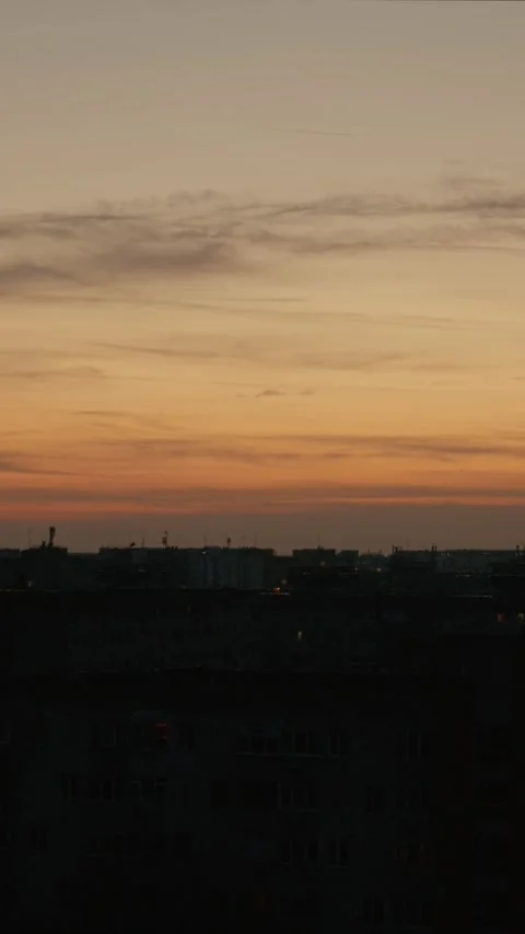 Vertical Screen Urban landscape at sunset with city skyline in silhouette Stock Footage 303505455
