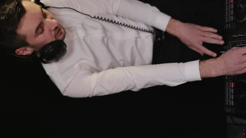 Vertical Screen Video. Dj perform in party concert. Happy man wear headphones Stock Footage 194767323