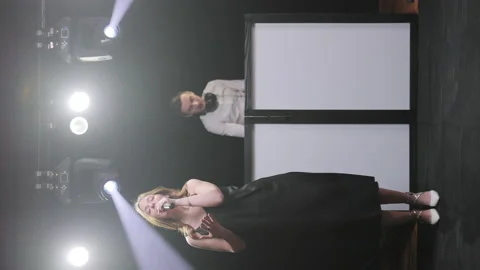 Vertical Screen Video of singer vocalist girl and dj man playing song performing Stock Footage 194767699