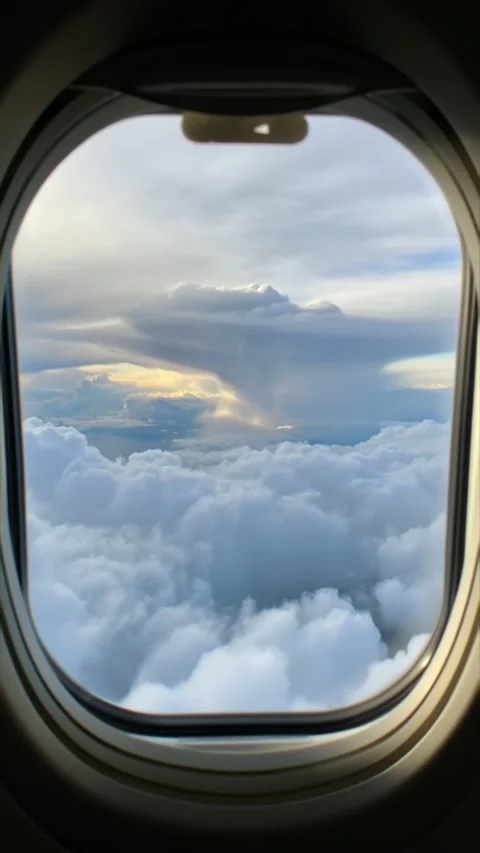 Vertical Screen: Views from an airplane window as you soar through the sky Stock Footage 317262625