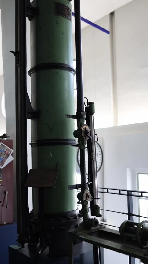Vertical screen: Vintage hydraulic piston mechanism from early water supply syst Stock Footage 304883808