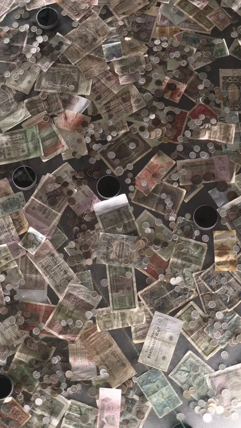 Vertical screen vintage paper banknotes and scattered coins displayed under glas Stock Footage 314516144