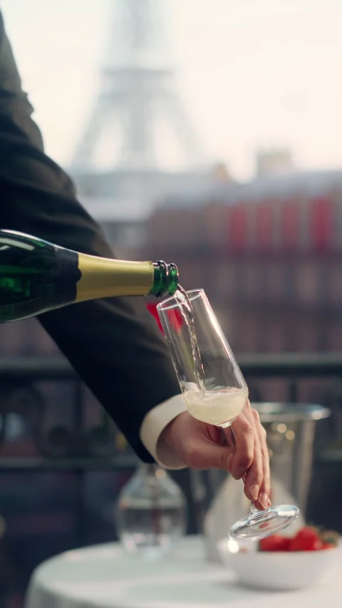 Vertical Screen Waiter Serving Champagne on Parisian Balcony Stock Footage 296173322