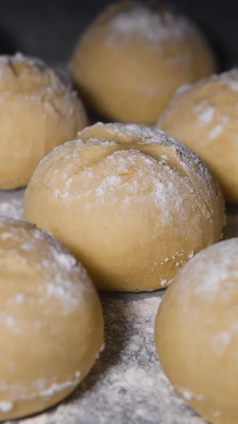 Vertical Screen: Warm fresh bread in a bakery. Cooking bread and eco production Stock Footage 232549591