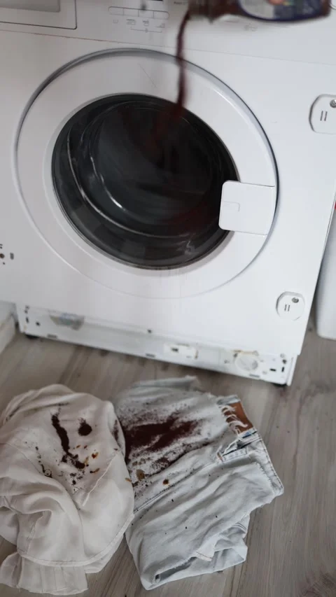 Vertical screen washing machine running cycle with dirty stained clothes on the  Stock Footage 318867741
