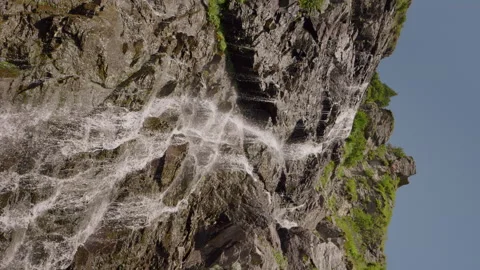 Vertical Screen Waterfall rushing through rocks down a mountain on a sunny day. Stock Footage 295866298
