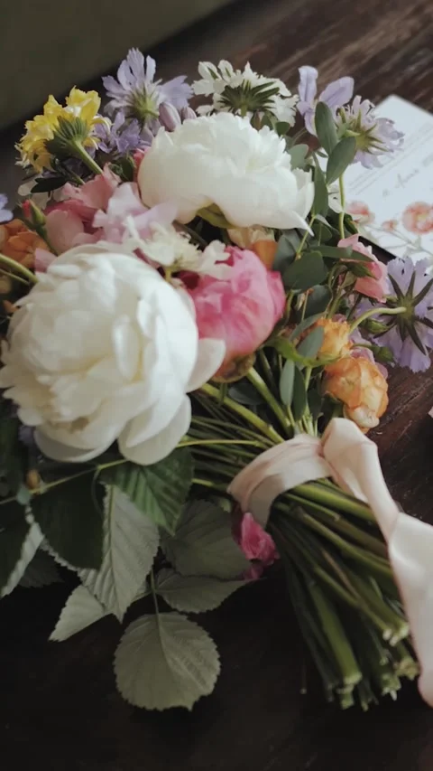Vertical screen: Wedding bouquet and rings. Beautiful Floral Arrangement and Stock Footage 307924988
