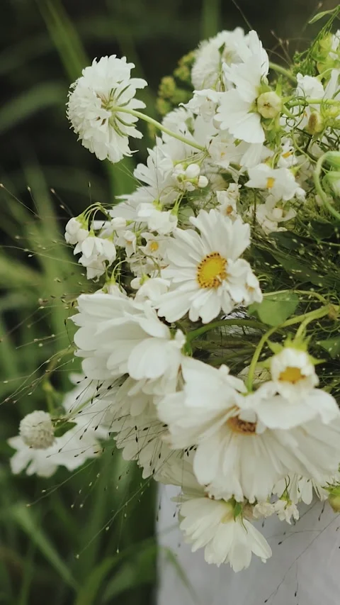 Vertical screen: wedding bouquet, placing it on the groom's shoulder. Beautiful Stock Footage 307771120