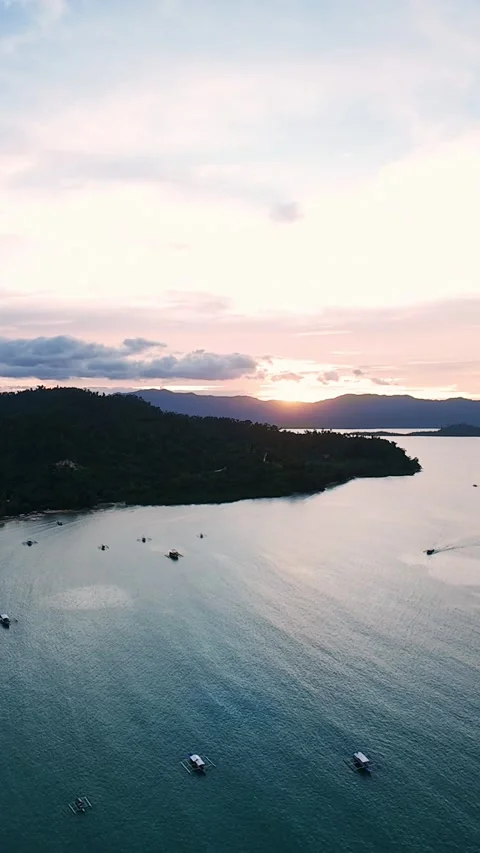 Vertical screen wide sunset aerial view of bay in Palawan, Philippines Stock Footage 318355986