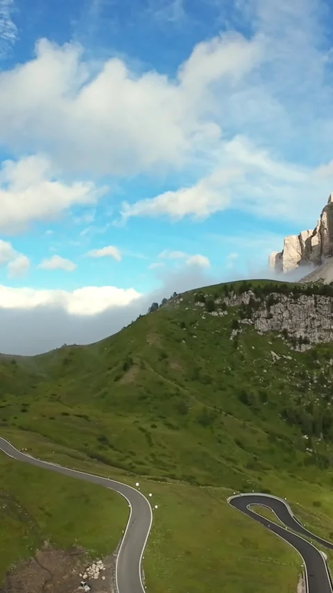 Vertical screen winding alpine road through Dolomites. Serpentine asphalt Video stock 323242533