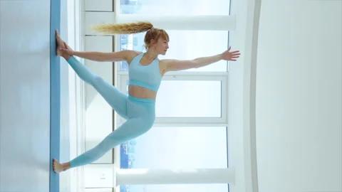 Vertical Screen: Yogi woman practicing Yoga Sequences in studio Stock Footage 233877873