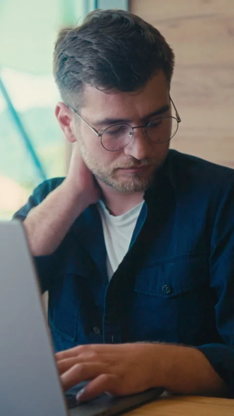 Vertical Screen: Young Caucasian Freelancer Experiencing Fatigue and Neck Pain Stock Footage 279235886