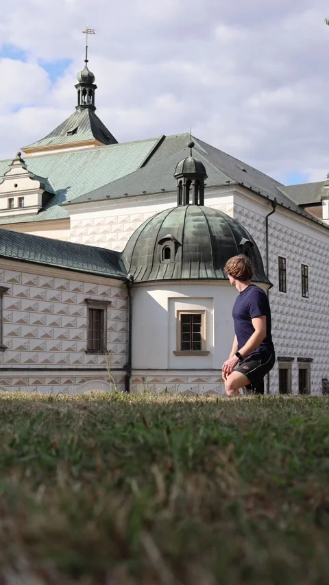 Vertical screen young man traveling and exploring historic European architecture Stock Footage 315413773