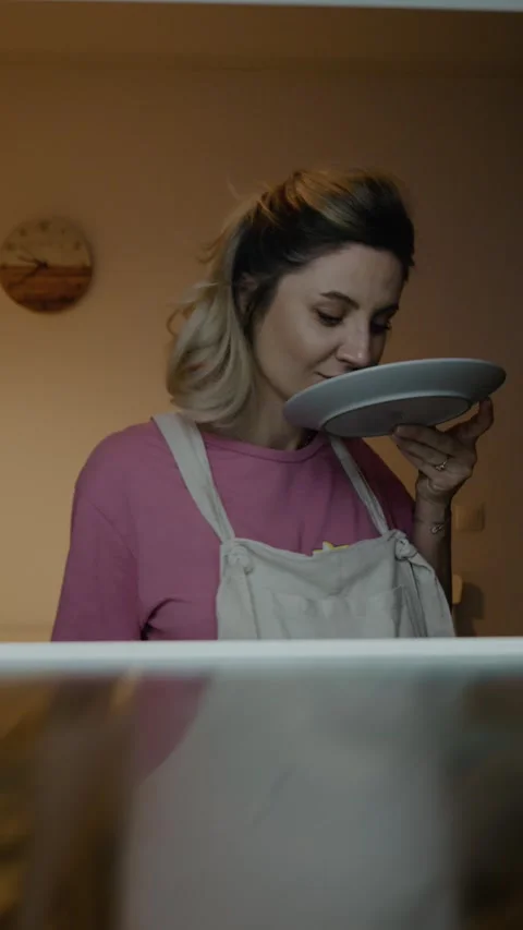 Vertical Screen Young pregnant taking donut on the plate out Stock Footage 303493869