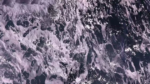 Vertical sea waves hit rocks and beach Видео 36748457