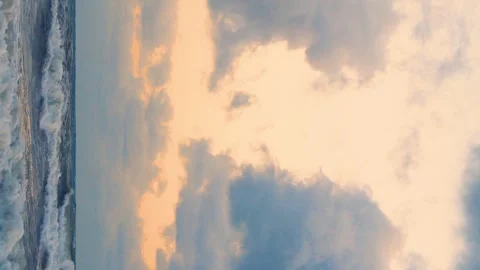 Vertical, Sea Waves Orange Yellow Sky Black Lilac Rain Cumulus Clouds in Sun Ray Stock Footage 306216655