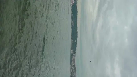 Vertical: Seagulls Fly Over Ferry Crossing Bosphorus, A City On The Horizon Video stock 196190405