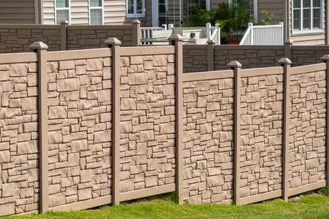 Vertical sections of brown profile fence the local area decor capital fencing Stock Photos