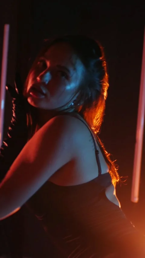 Vertical. Seductive dance performance of sexy woman in black bodysuit Stock Footage 302667445