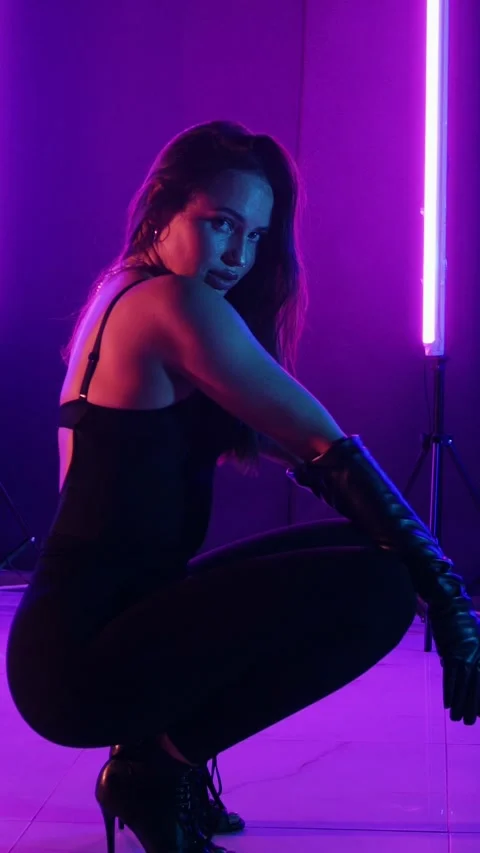 Vertical. Seductive dance performance of sexy woman in black bodysuit Stock Footage 302668112