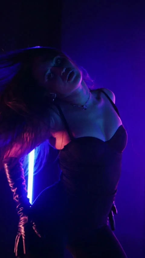 Vertical. Seductive dance performance of sexy woman in black bodysuit Stock Footage 302668690