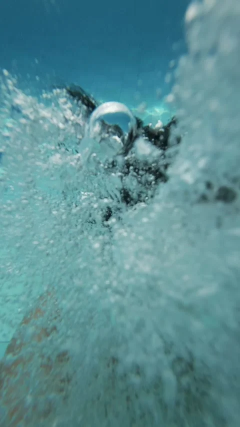 Vertical Selfie POV View of Man Jumping into Luxury Villa Swimming Pool with Stock Footage 337954715