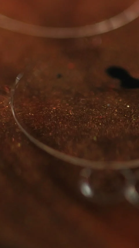 Vertical serum bubbles oil fluid bronze glitter Stock Footage 303570677