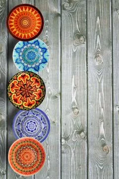 Vertical Set of decorative ceramic plates hand painted dot pattern with acryl Stock Photos