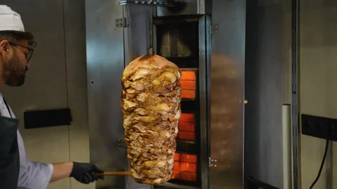 Vertical Shawarma Meat Roasting on Grill Spit Stock Footage 311483834