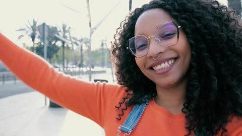 Vertical shoot of beautiful happy young woman smiling wearing glasses and a Stock Footage 248295276