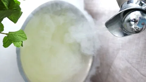 Vertical shoot. The chef cooks natural ice cream from cream , syrup and liquid Stock Footage 230565686