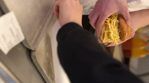 Vertical Shoot : Chef serves prepared hamburgers Stock Footage 196170598