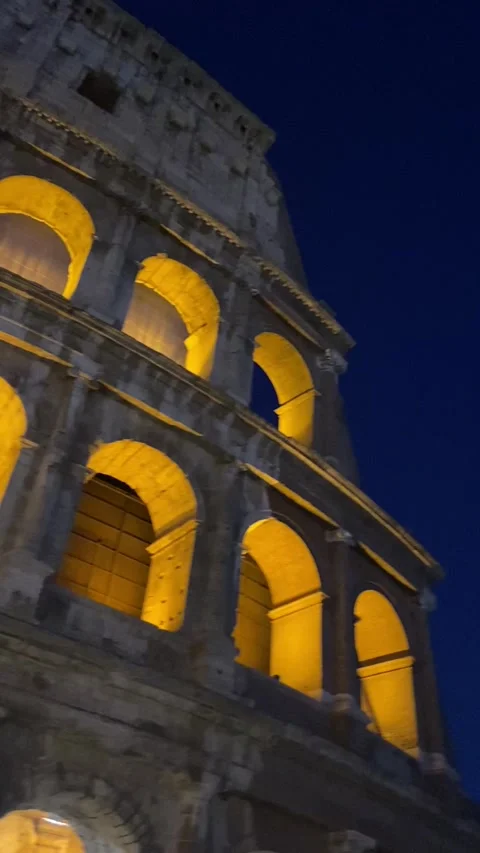 Vertical shoot of the Colosseum at night Stock Footage 280932928