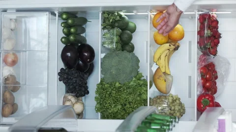 Vertical Shoot of Fridge or Refrigerator Full of Fresh Organic Vegetables and Stock Footage 168170528