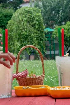 A vertical shoot of two lemon slush with some snaks Stock Photos