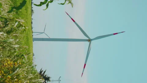 Vertical Shoot of Wind Turbines that Generate Energy Stock Footage 242481056