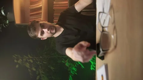 Vertical shooting, a man pays bills through a mobile app Stock Footage 264883737