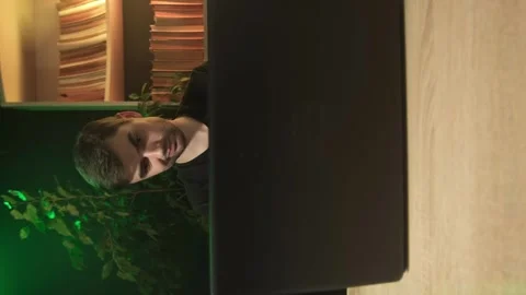 Vertical shooting, a man works in the office at a computer Stock Footage 264882533