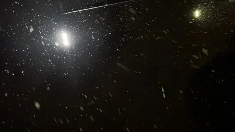 Vertical shooting, snowfall at night under a lantern, it is snowing, blizzard Stock Footage 262059129