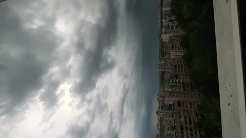 Vertical shooting, timelapse of the city, cloudy sky, thunderclouds, hurricane Stock Footage 262060859