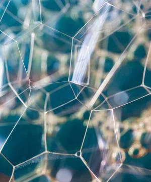 Vertical shot of abstract bubble patterns with blue background Stock Photos