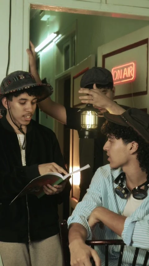 Vertical Shot of Actors Rehearsing Script Backstage with Steampunk Props Stock Footage 321680142