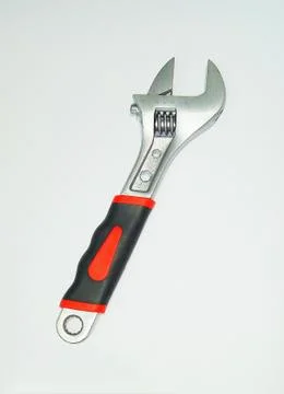 Vertical shot of an adjustable spanner isolated on a white background Stock Photos