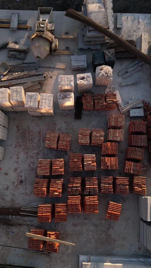 Vertical shot. Aerial view of building materials on a construction site Video stock 333143645
