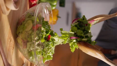 Vertical Shot of Balanced Eating in Action: A Colorful Mediterranean Salad Stock Footage 294961713
