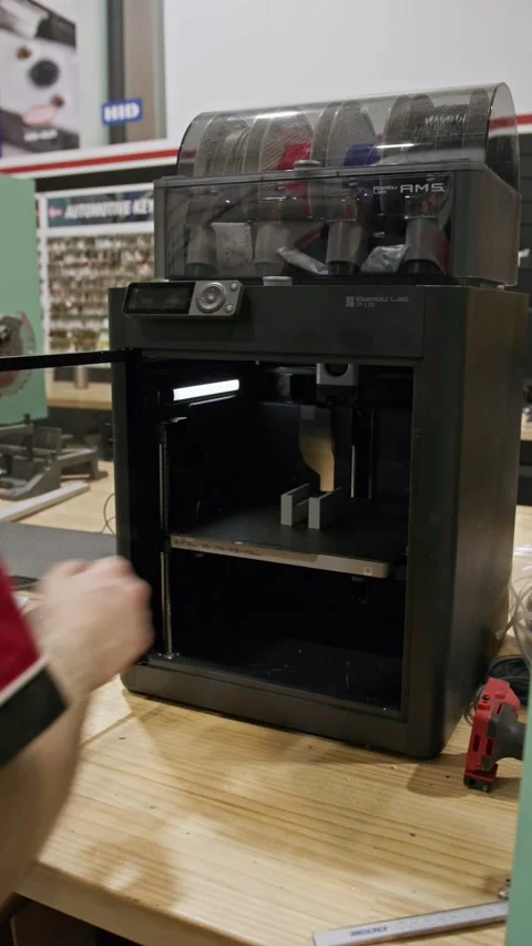 Vertical Shot of Bambu Lab P1S 3D Printer Opening Door in Workshop Stock Footage 334250486